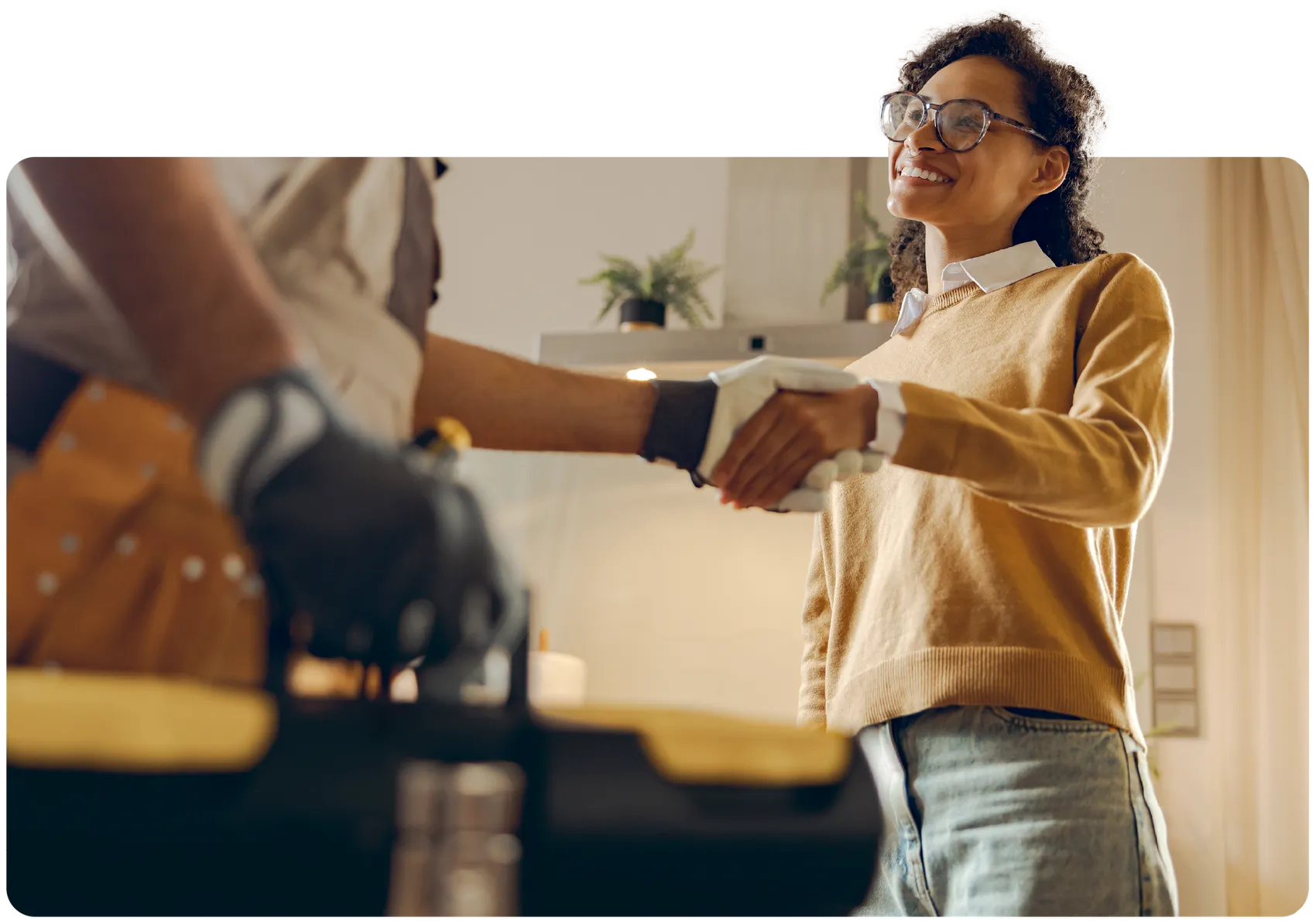 Smiling homeowner greeting a vetted Fyxify technician at the door